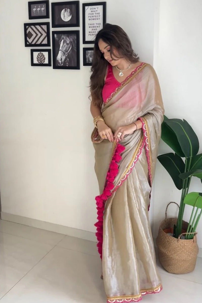 Fairytale Beige Mul Mul Tissue Silk Saree With Handmade Tussels