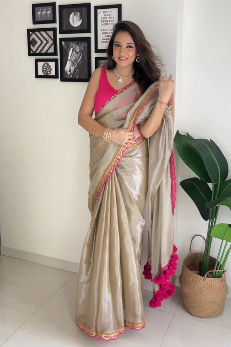 Fairytale Beige Mul Mul Tissue Silk Saree With Handmade Tussels